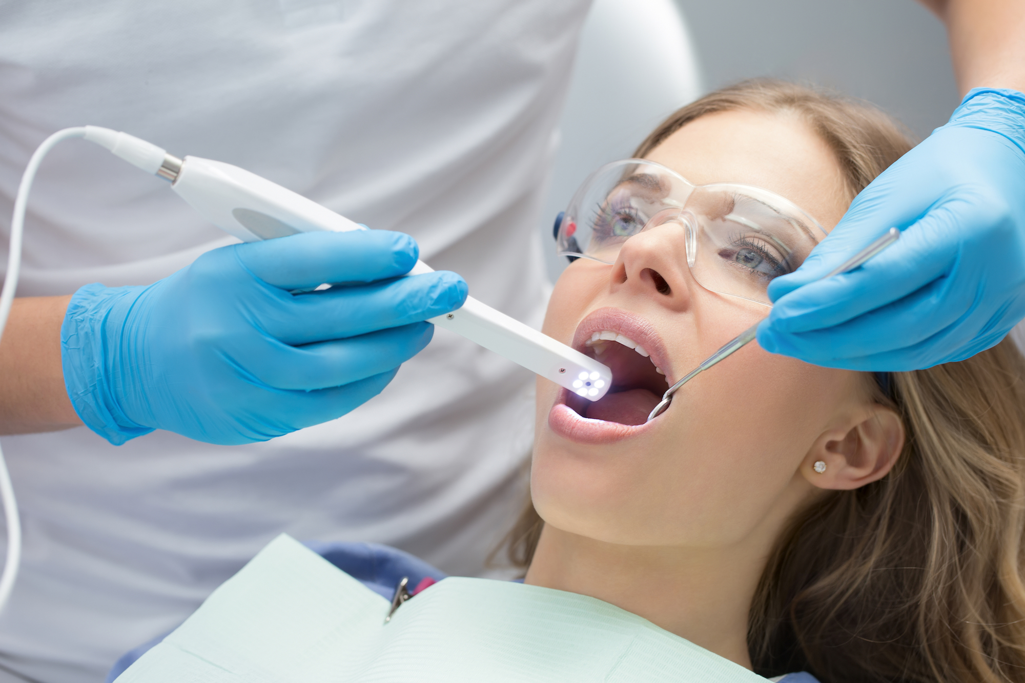 young woman getting dental treatment